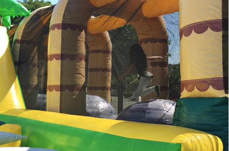 Giant inflatable ball challenge inside obstacle course bouncy house